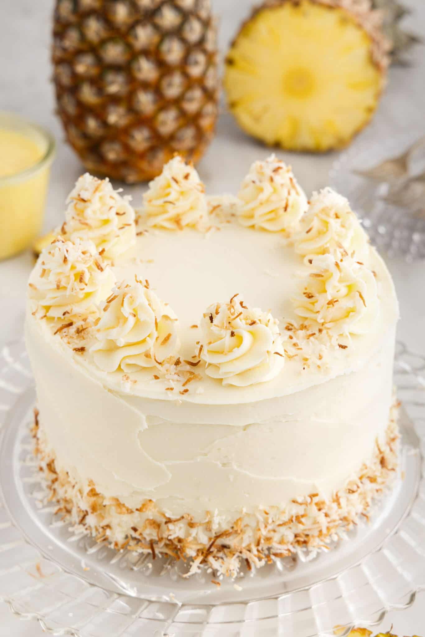 Pineapple Coconut Cake on a cake stand.